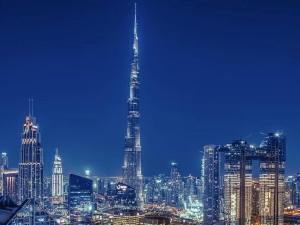 Burj Khalifa and Downtown Dubai skyline illuminated at night, representing the AI-driven transformation of Dubai's real estate investment market